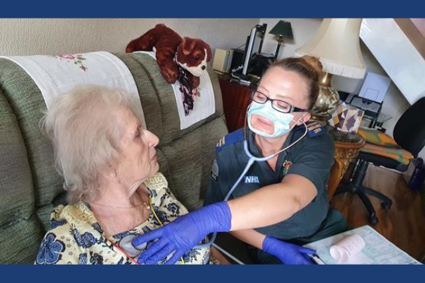 Elderly Patient and Healthcare Working in Clear Expression Face Coverings