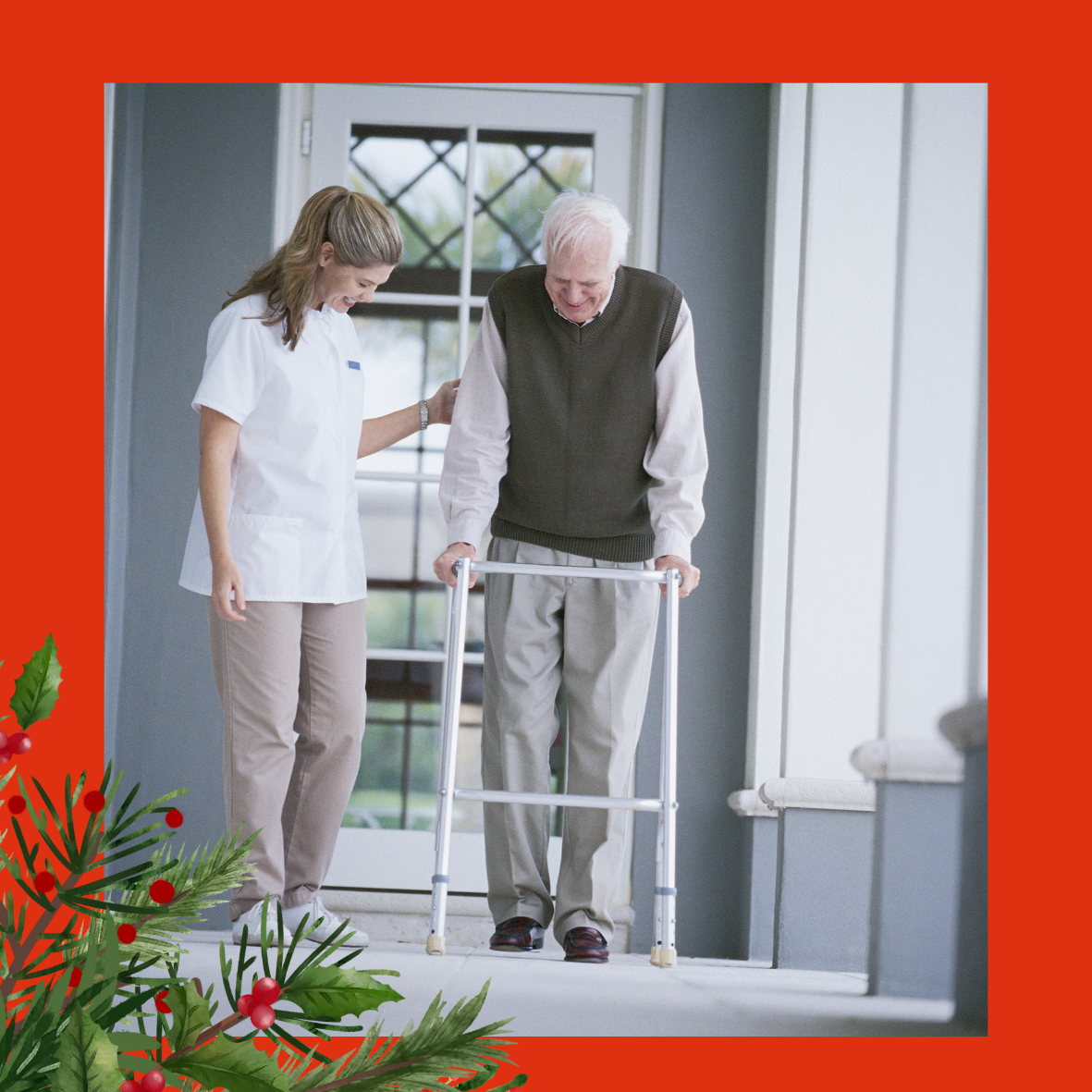 An image on a red background of a professional, who is a woman wearing a white tunic, smiling and helping an older gentleman to use a walking frame. In the corner of the image is a holly bush with red berries. 