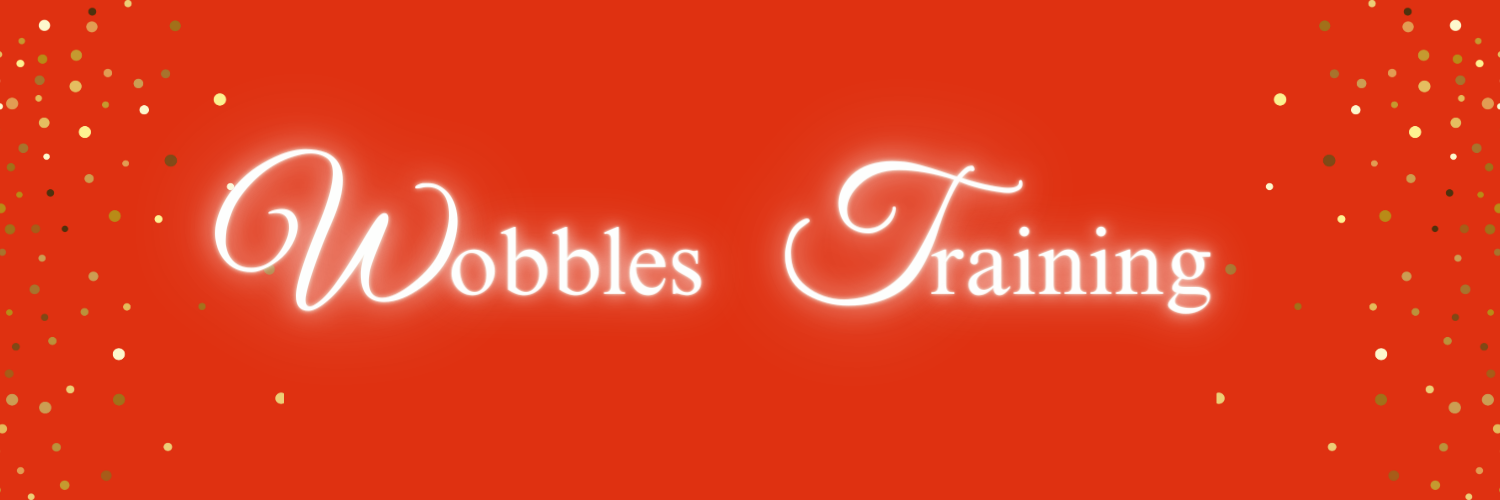 A red banner image with the words Wobbles Training. There is gold glitter down each side of the banner image.
