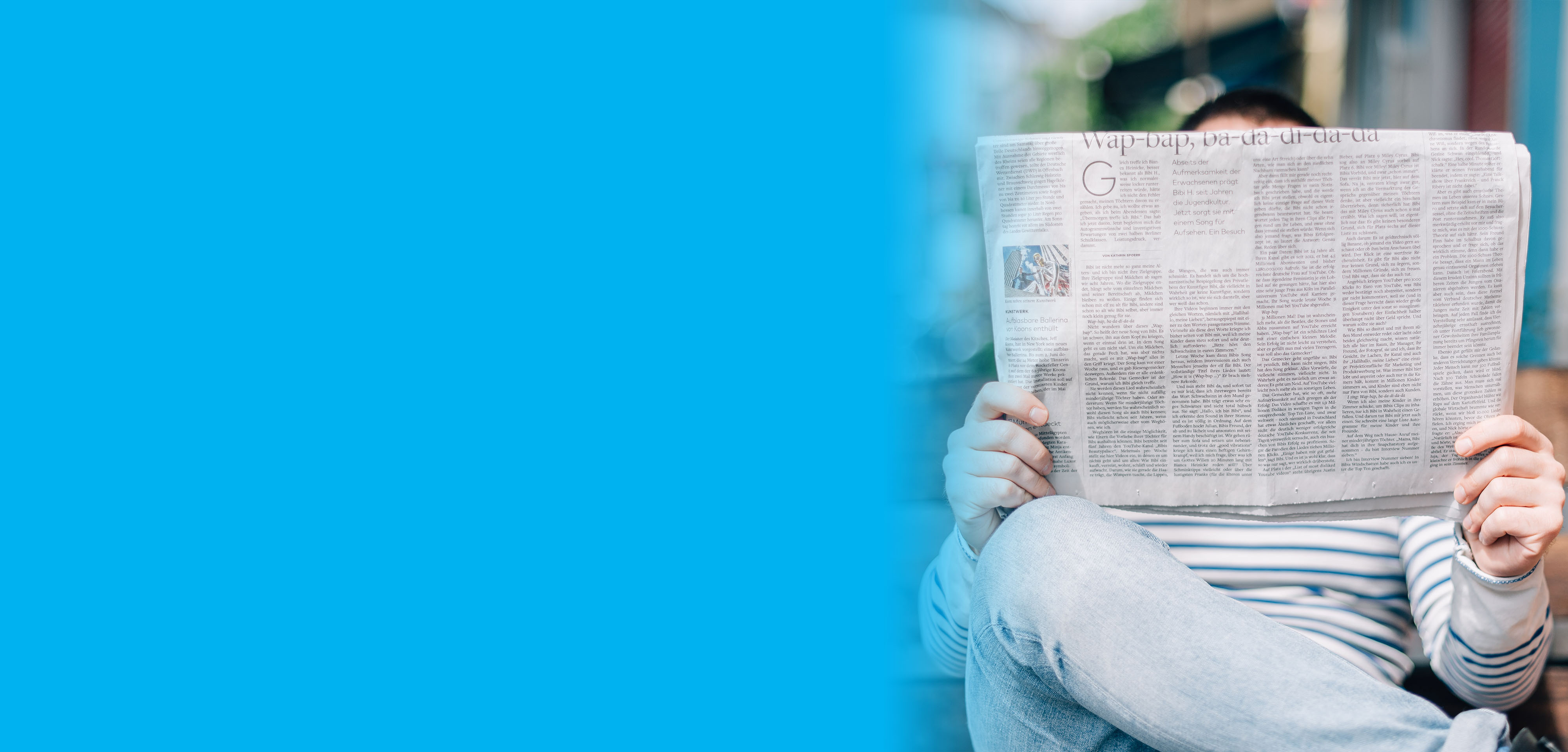 A person reading a newspaper