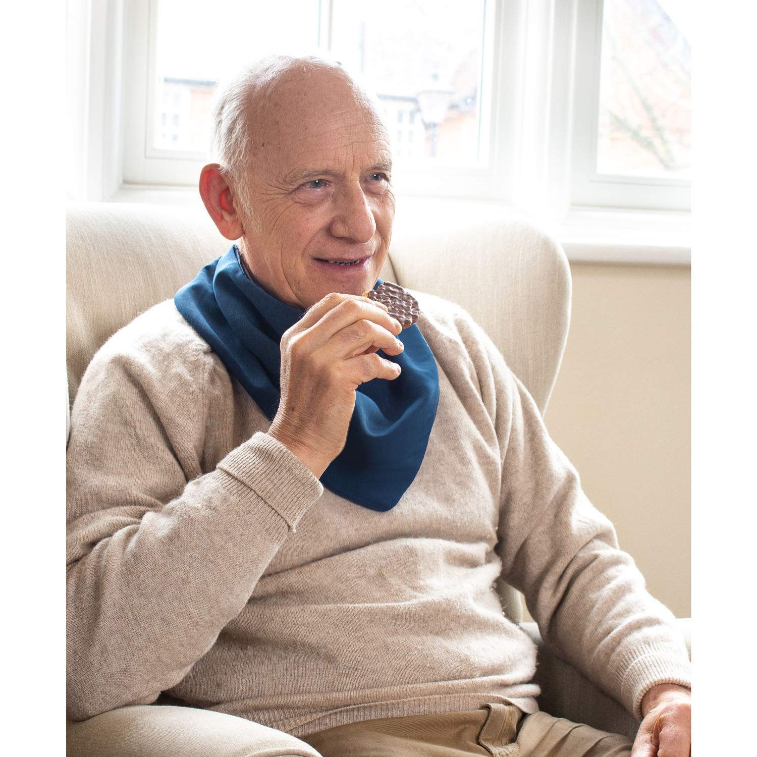 Older person bluewearing clothes protector