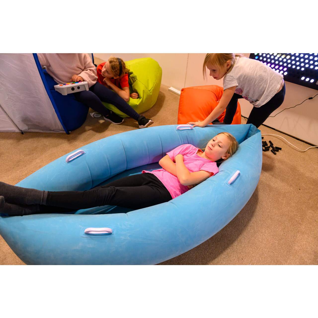 Child laying in Light blue Pea Pod  