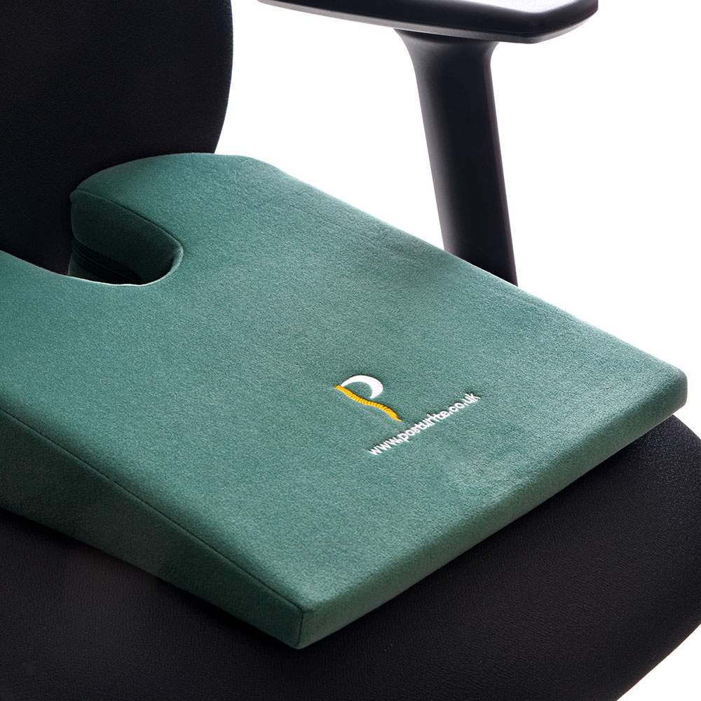 Posturite Coccyx Cut-out Wedge - close up, shown on an ergonomic chair