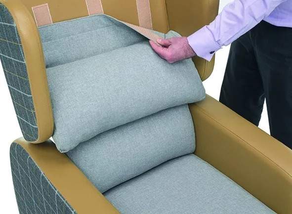 Person removing cushions from seat back