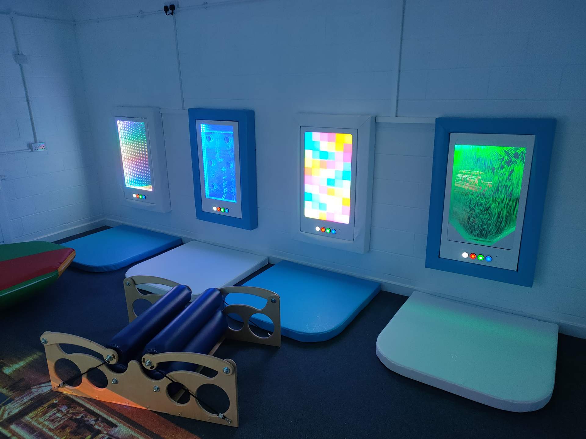 Interactive Snow Fall panel, installed into a sensory room with other interactive wall panels