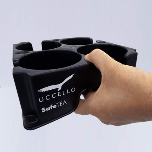 Hand holding an empty Muggi Cup Holder