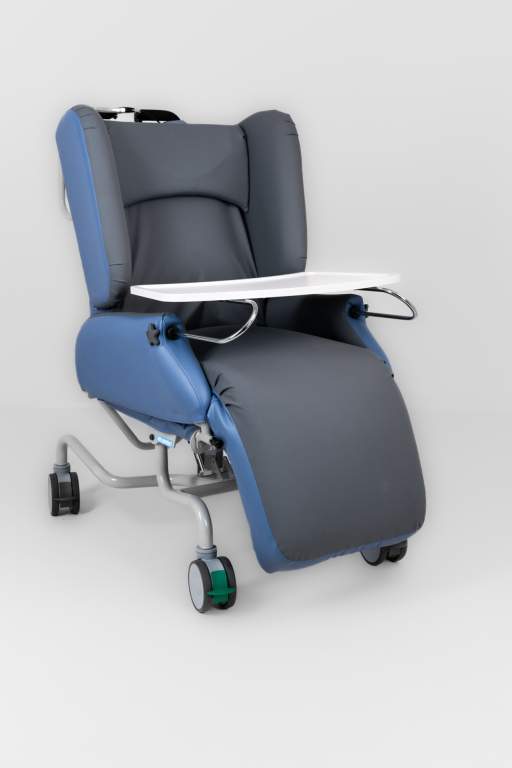 an air comfort tilt in space ward chair with meal tray in blue