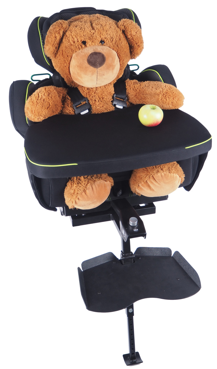 Teddy bear sitting in SIMON car seat with table across its lap