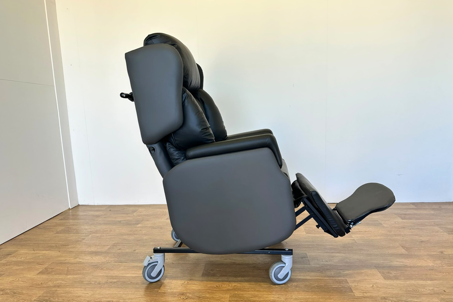 Astro Dinton Care Chair  Side view legrest elevated