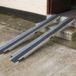 Metro Mobility telescopic budget channel ramps deployed on steps